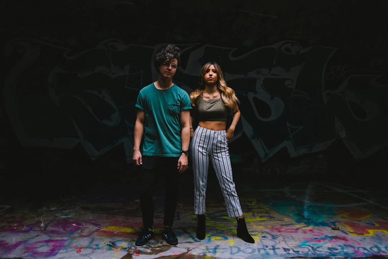 man and woman standing close together