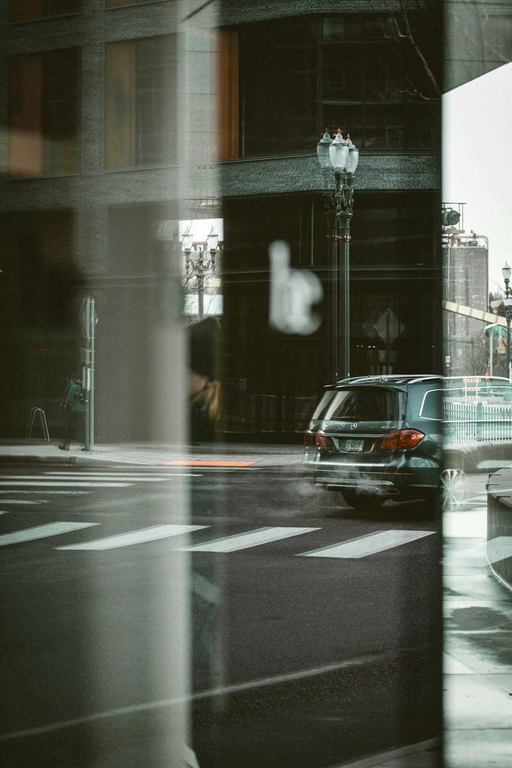 a blurry picture of a car driving down a street