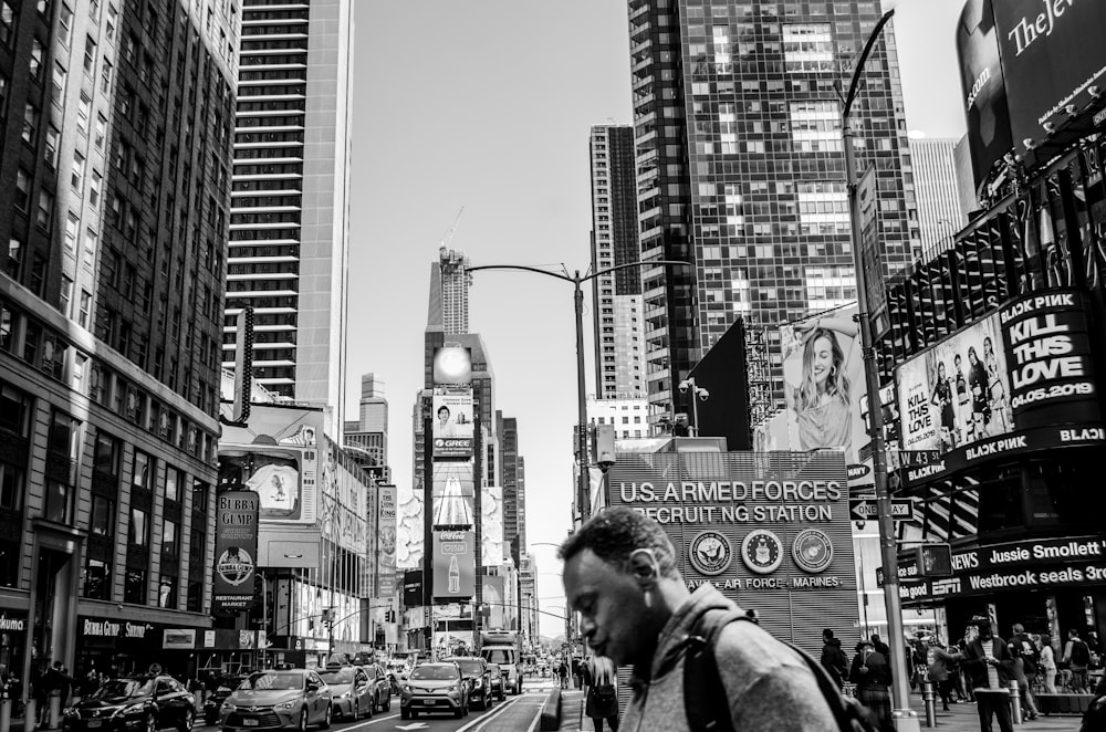 person walking in road during daytime