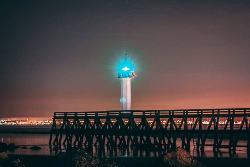 turned-on white lighthouse