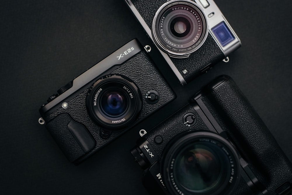 three black cameras