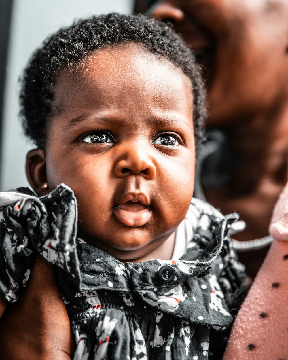 baby girl wearing black floral dress