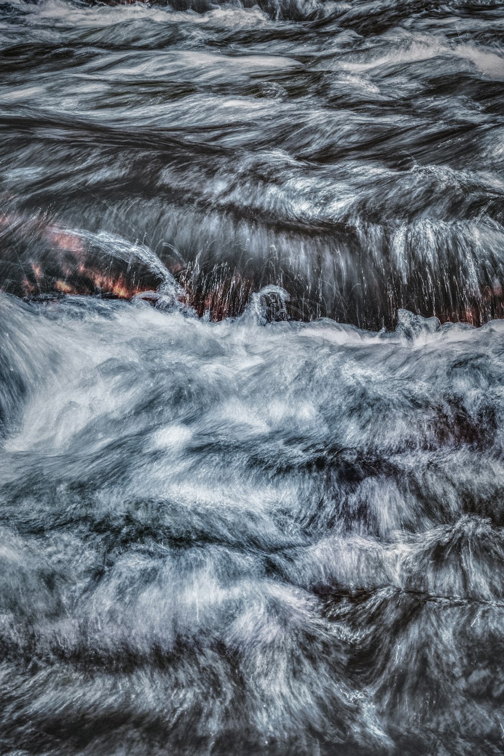 a large body of water surrounded by waves