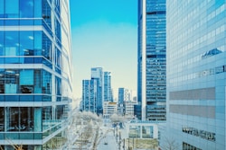 a city street lined with tall buildings next to each other