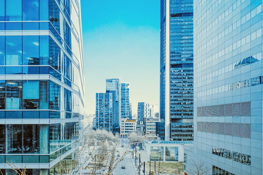 a city street lined with tall buildings next to each other