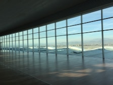 Wide-angle photo capturing the open layout of the Sky Suite with minimalistic furnishings and spacious floor.
