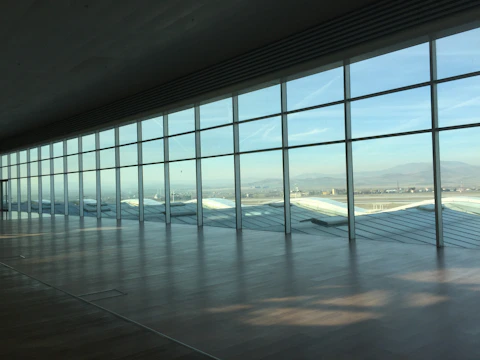 A sleek, modern extension with floor-to-ceiling windows overlooking a serene landscape.