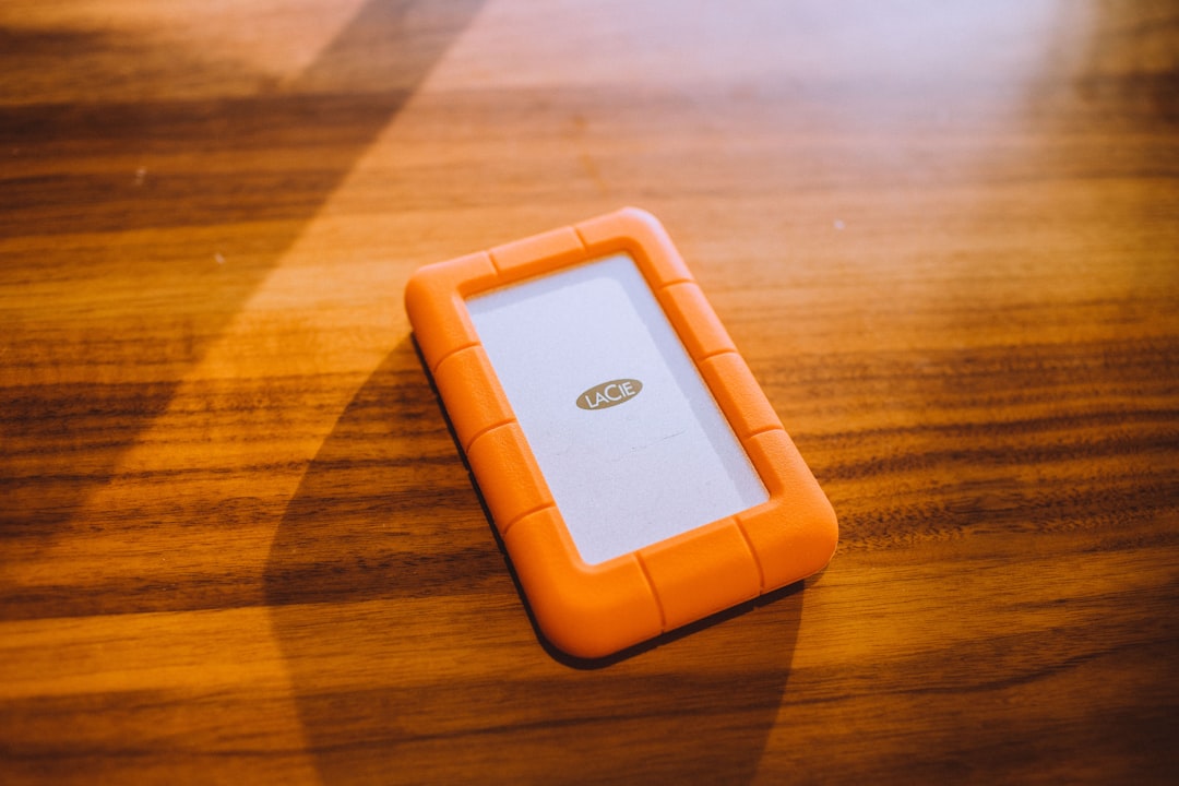 white and orange case on brown surface