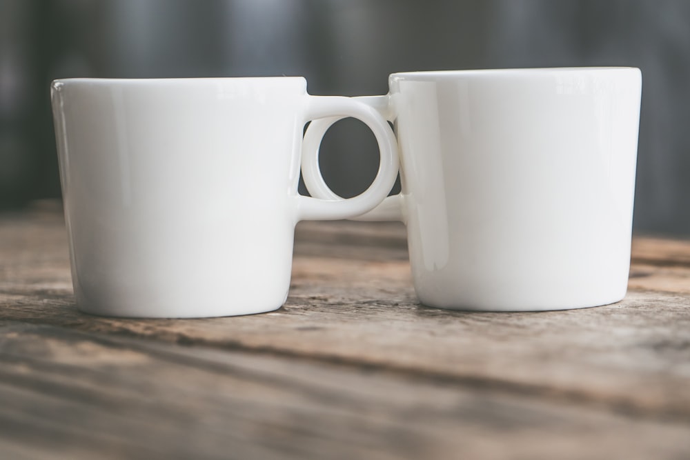 two white ceramic mugs