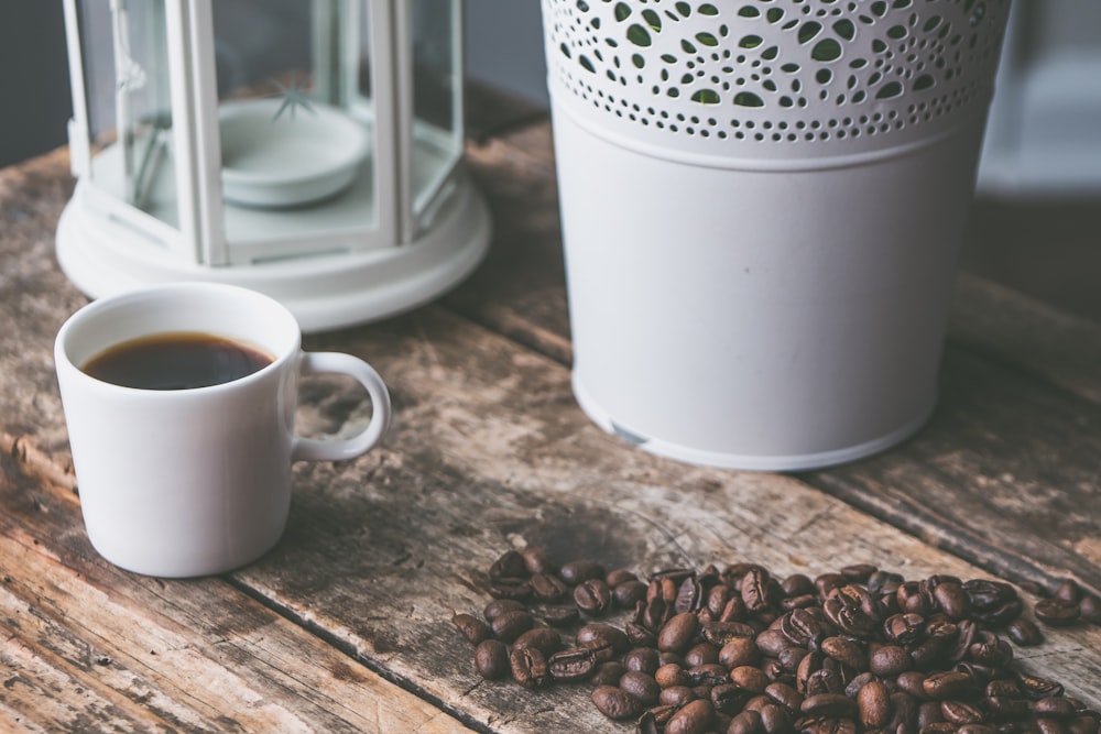 white ceramic teacup with coffee