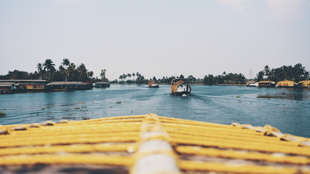 three boats on body of water