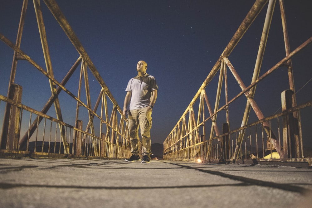 man walking down the bridge