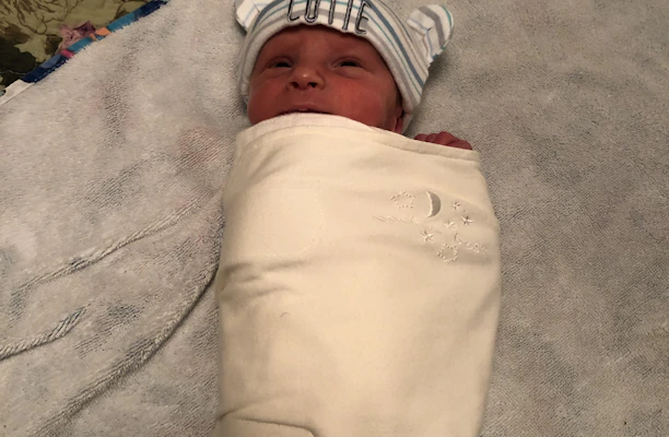 A soft, cuddly personalized plushie with a newborn's name embroidered on its chest.