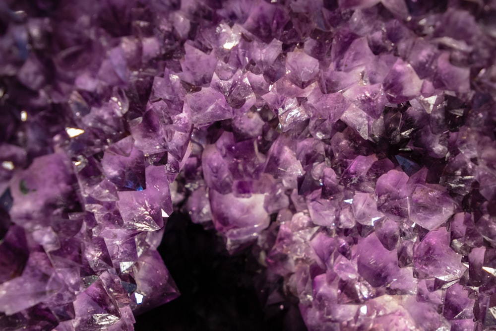 a close up of a bunch of purple crystals