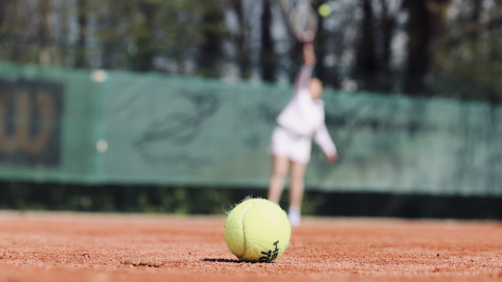 green lawn tennis ball on ground