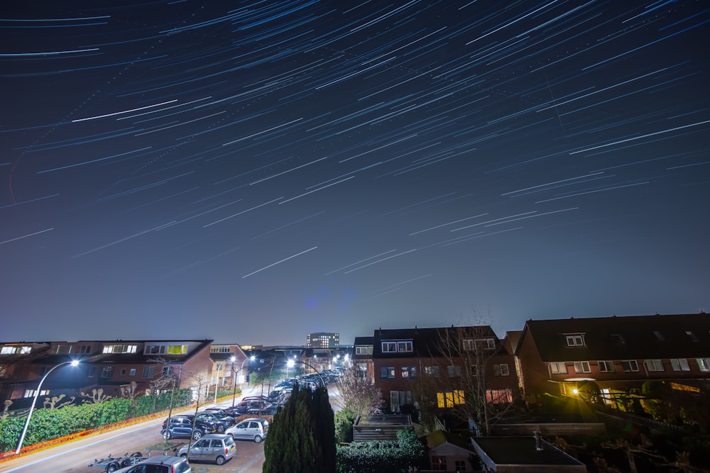time lapse picture of a night sky over a town