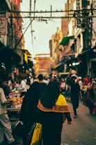 people walking between buildings