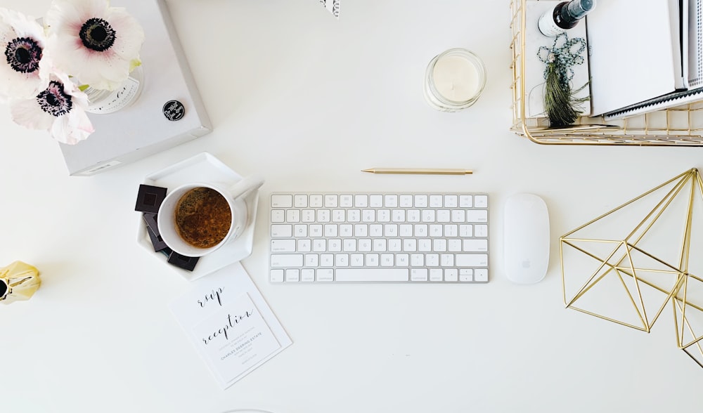 white Apple Keyboard and white Apple Magic Mouse