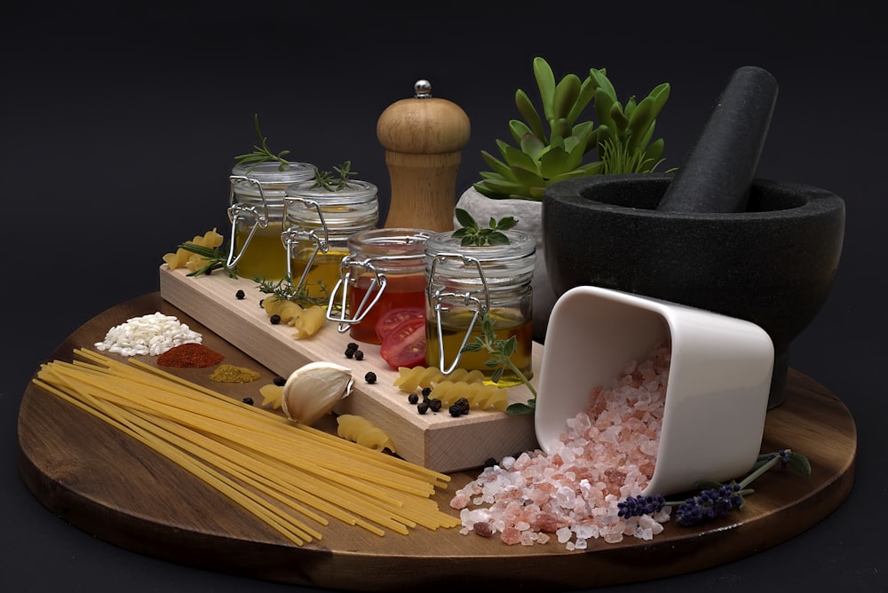 a wooden tray topped with lots of different types of food