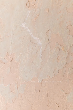a close up of a wall with some paint on it