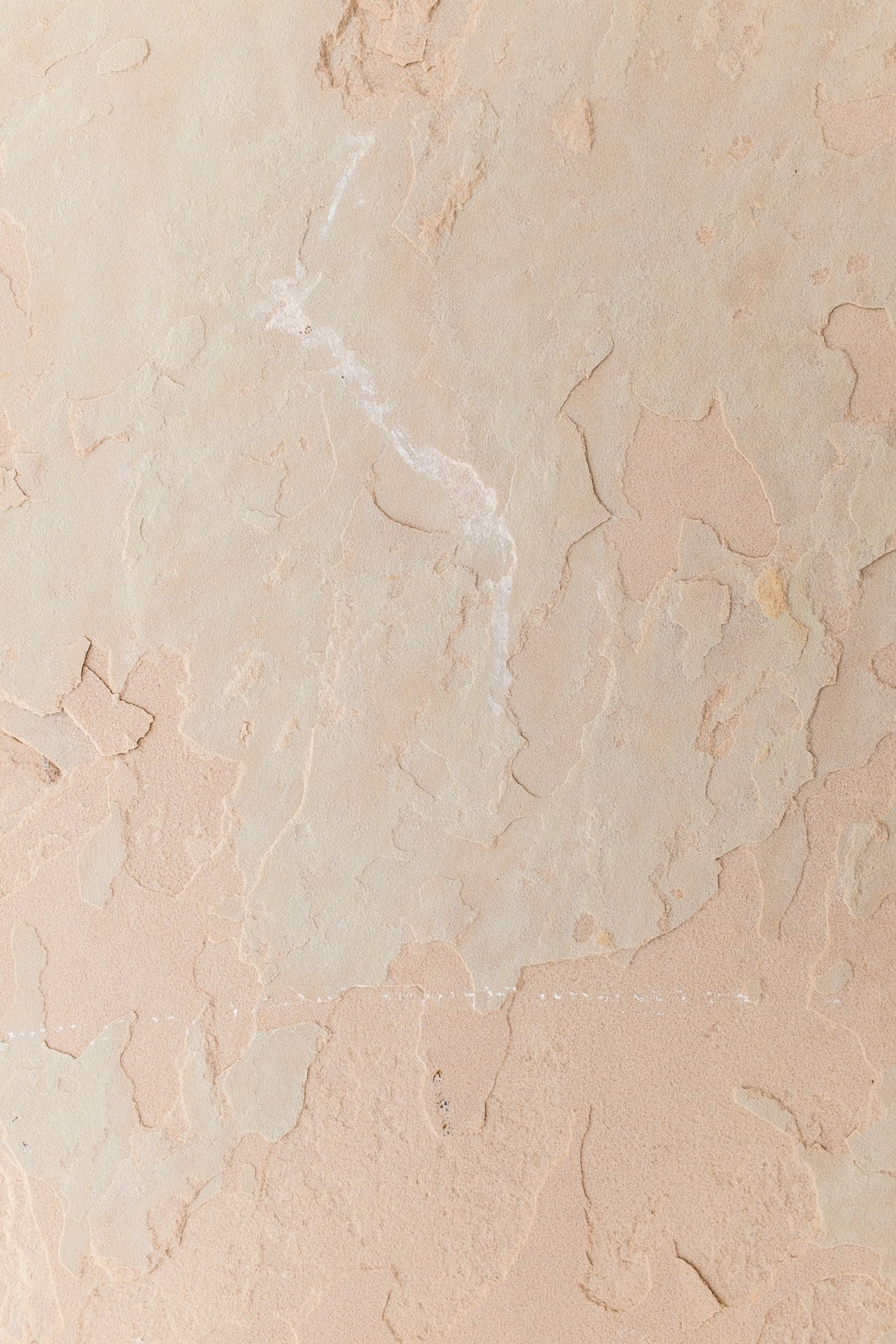 a close up of a wall with some paint on it