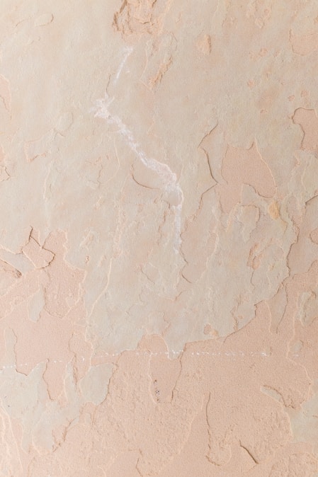 a close up of a wall with some paint on it