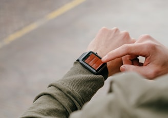 man using his smartwatch