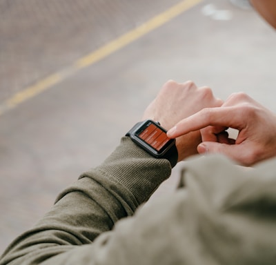 man using his smartwatch