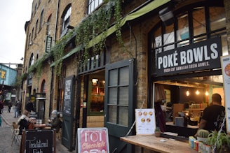 Fresh poké bowls and burritos served in a casual self-service area near the beach umbrellas