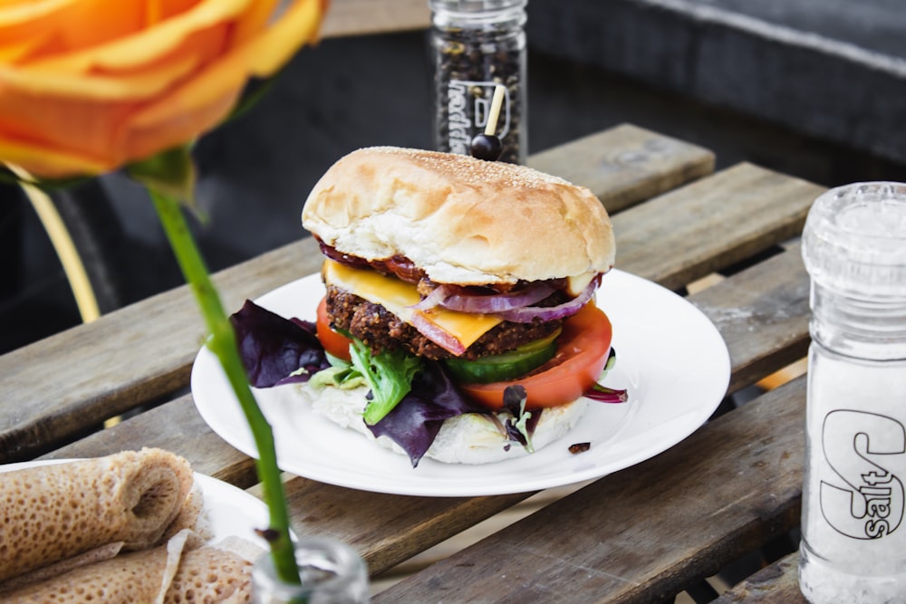 burger with tomato on plate