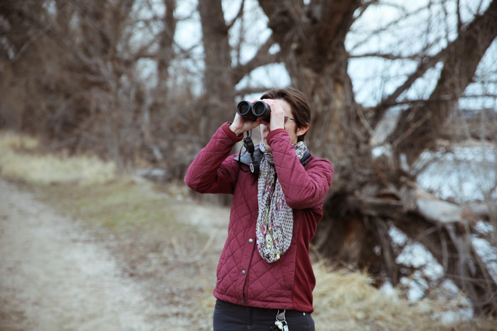 man using binoculars