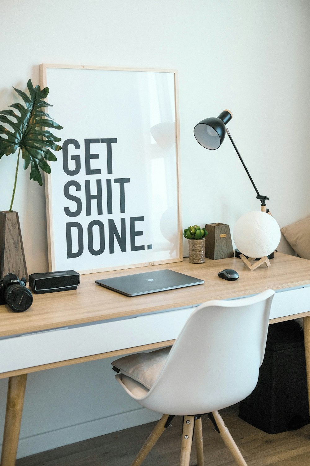 brown and white wooden desk with chair and laptop