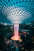 water fountain inside building surrounded with crowd