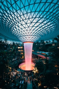 water fountain inside building surrounded with crowd