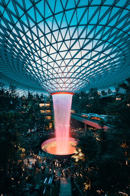 water fountain inside building surrounded with crowd