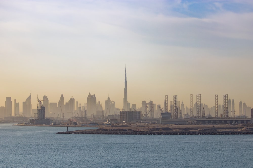 a large body of water with a city in the background