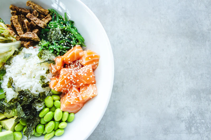 Fresh ingredients for Italian pasta salad including vegetables, mozzarella and salami