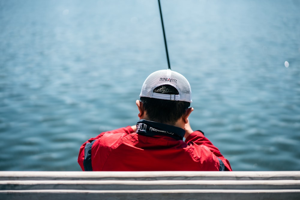 person facing body of water