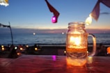 A summer candle with a beach and sun motif.