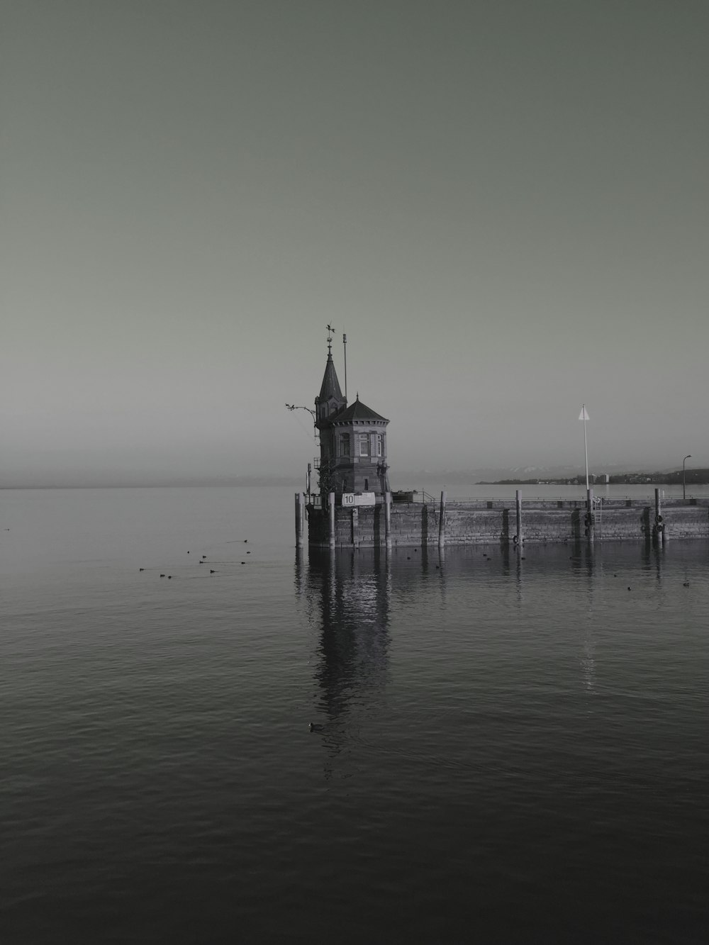 gray house above body of water