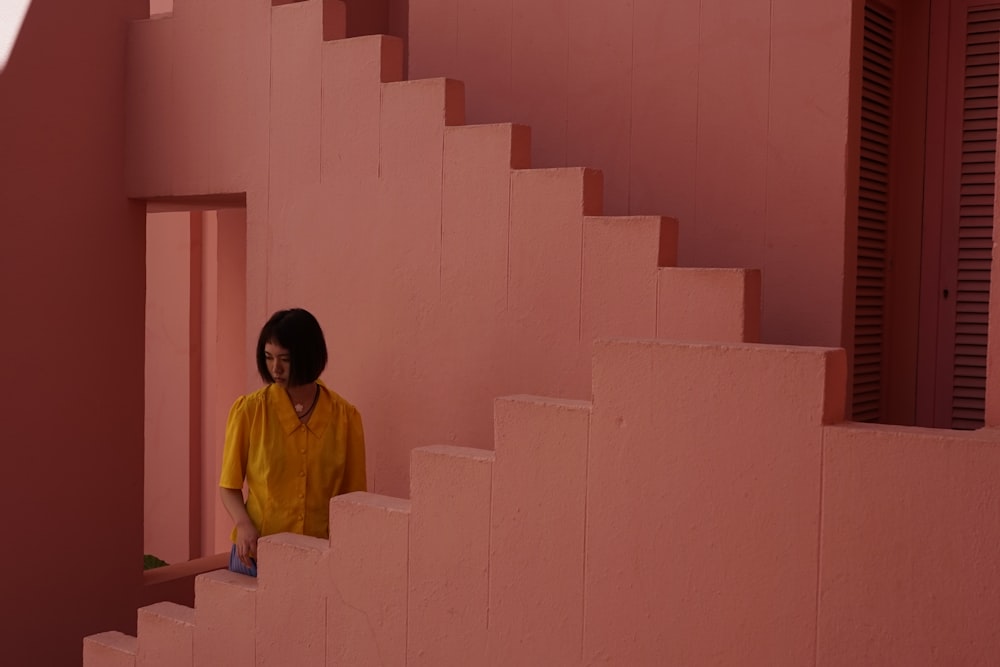 woman standing near white stairs