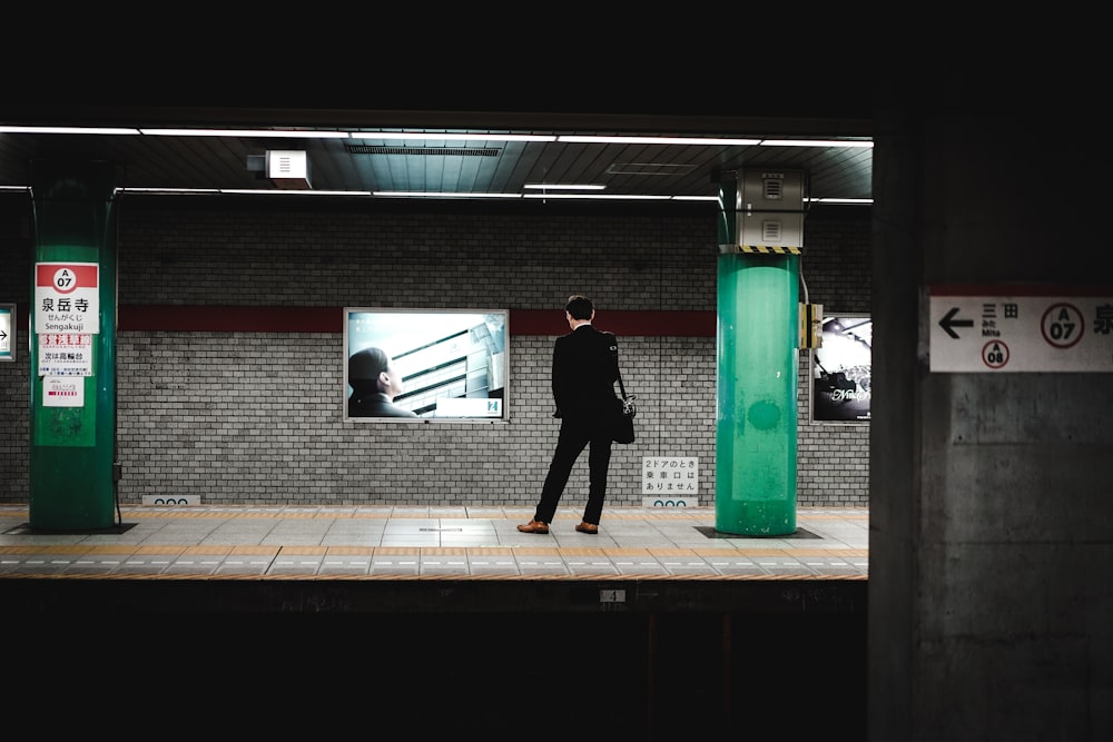 person standing inside train station