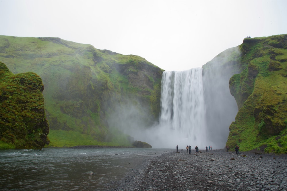 people near on waterfalls