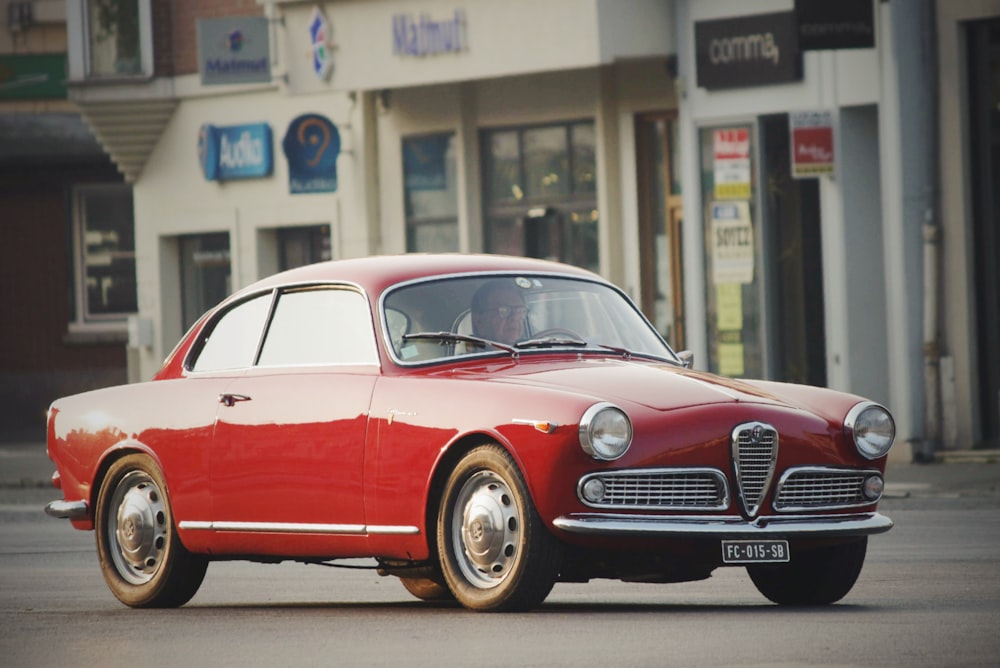 vintage red Bugatti coupe at the street