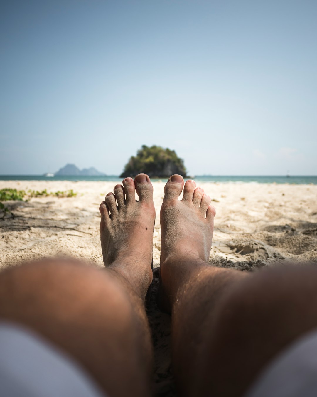 person lying on seashore