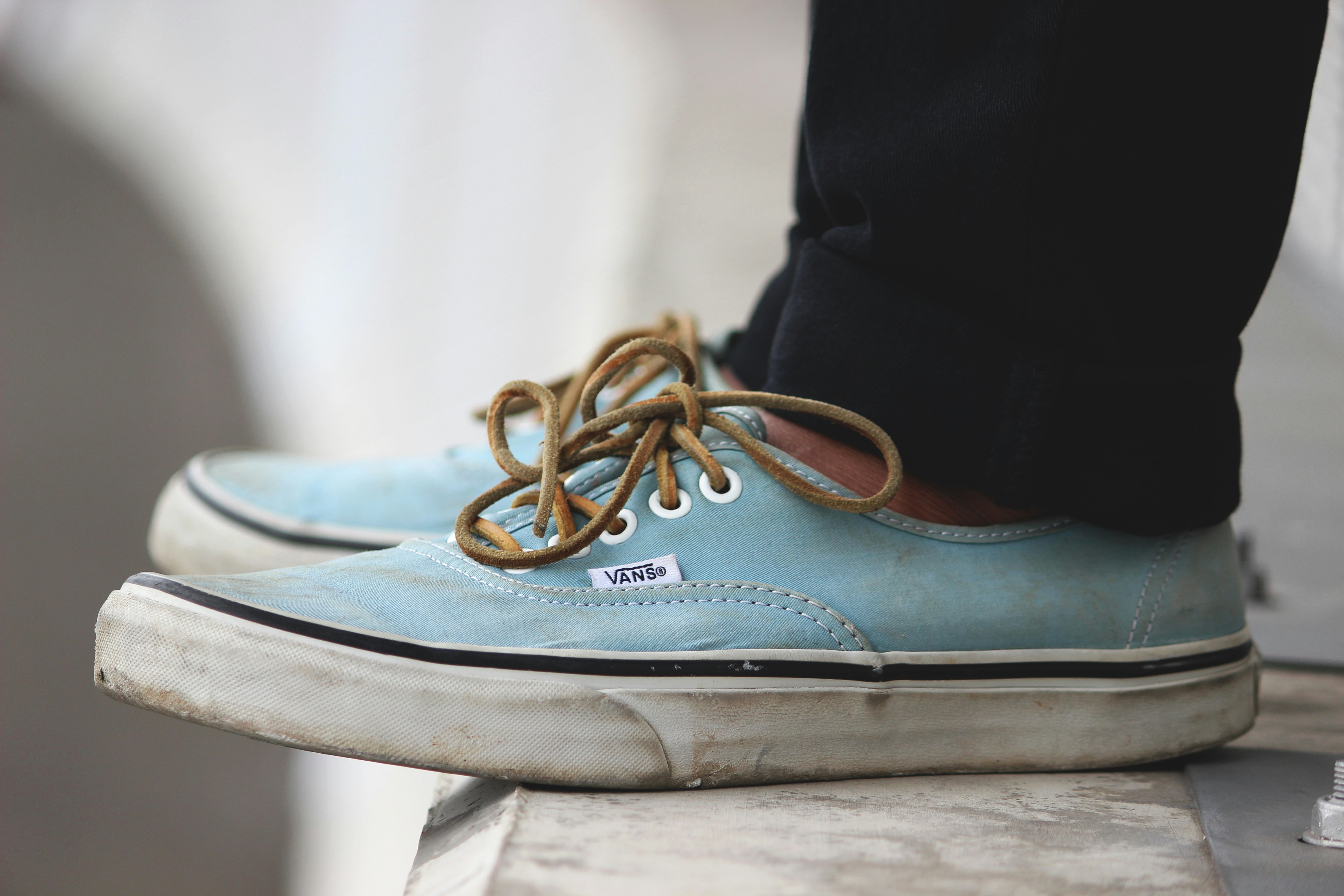 beige-and-white Vans low-top sneakers