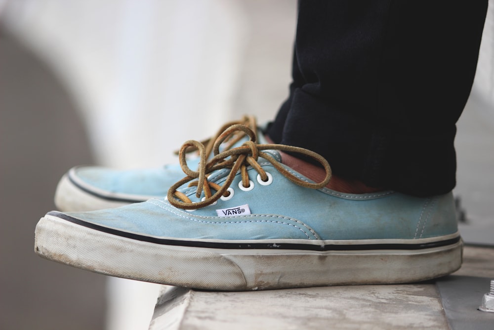 beige-and-white Vans low-top sneakers