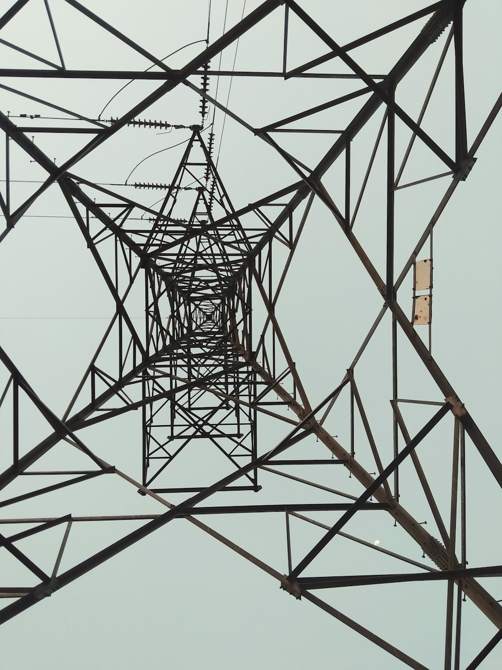 black metal tower in low angle photography