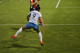 Close-up of a kabaddi player mid-action with performance metrics overlay.