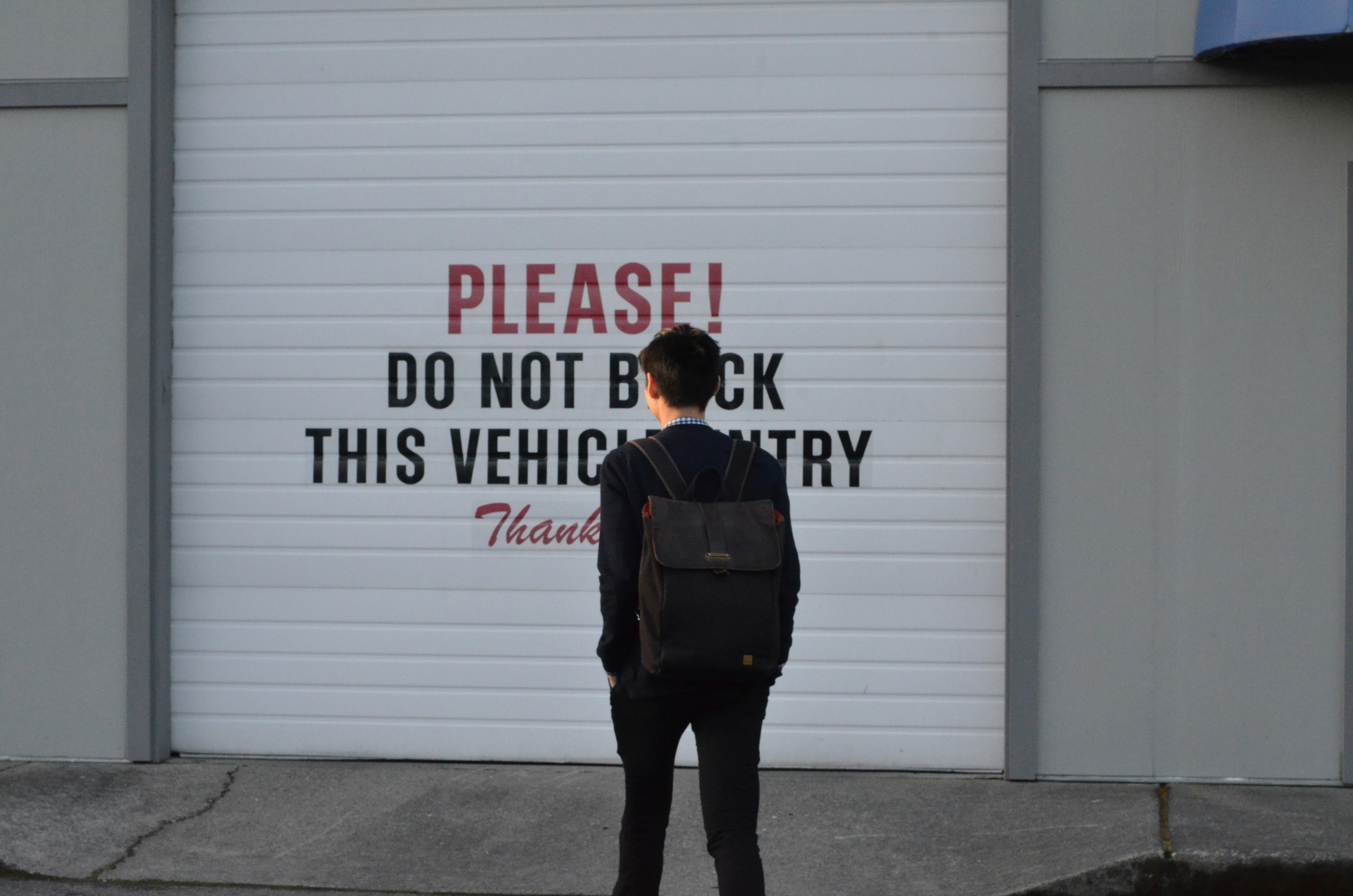 man carrying backpack